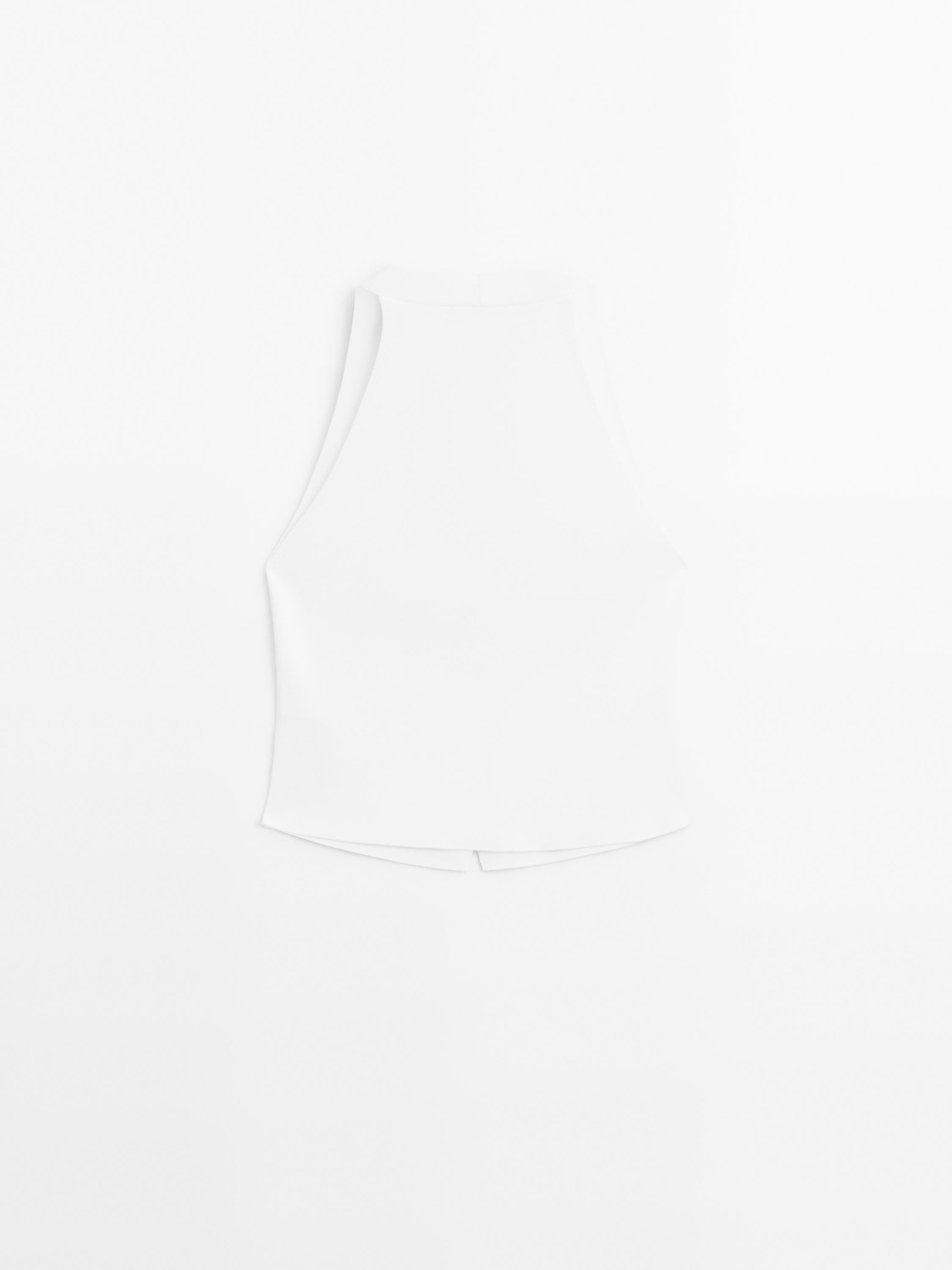 Veste sans manches en maille boutons contrastants